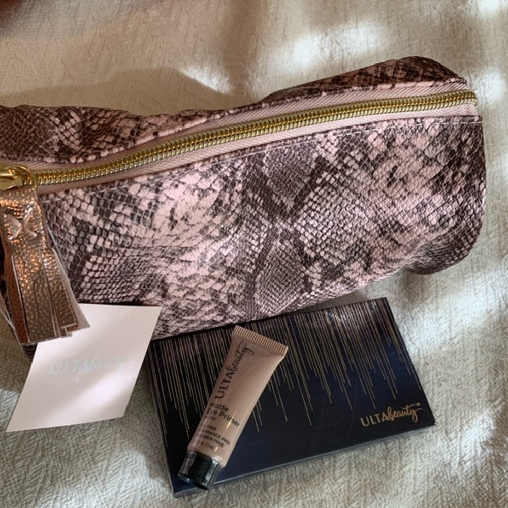 Ulta pink faux snakeskin makeup bag with primer and eye shadow pallet